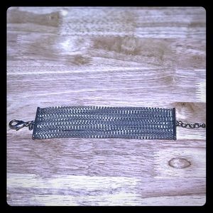 Multi strand silver toned bracelet